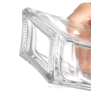 Botella de vidrio blanco alto y transparente